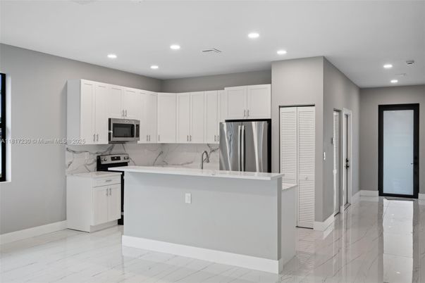 Interior, Kitchen, Marble, Marble Walls, Recessed Lighting, Stainless Steel Appliances
