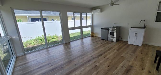Empty room, Interior, Kitchen, Stainless Steel Appliances, Wood Texture Flooring