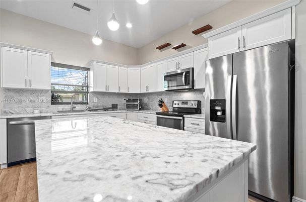 Interior, Kitchen, Pendant Lights, Recessed Lighting, Stainless Steel Appliances, Wood Texture Flooring