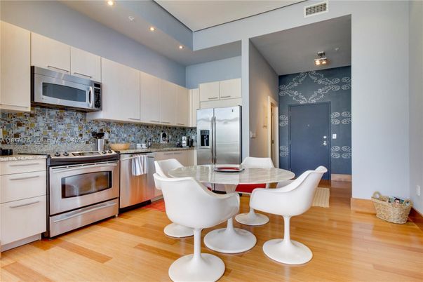 Dining room, Interior, Kitchen, Recessed Lighting, Stainless Steel Appliances, Wood Texture Flooring
