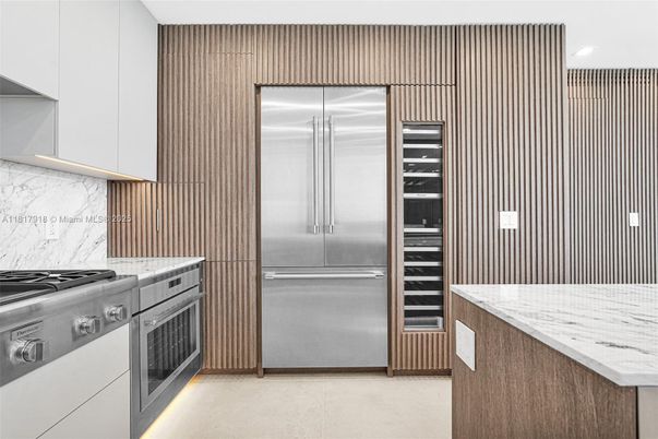 Interior, Kitchen, Marble Walls, Recessed Lighting, Stainless Steel Appliances