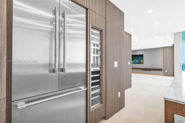 Interior, Kitchen, Marble Walls, Recessed Lighting, Stainless Steel Appliances
