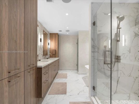 Bathroom, Dual Sink Vanities, Glass Shower, Interior, Marble, Marble Walls, Recessed Lighting