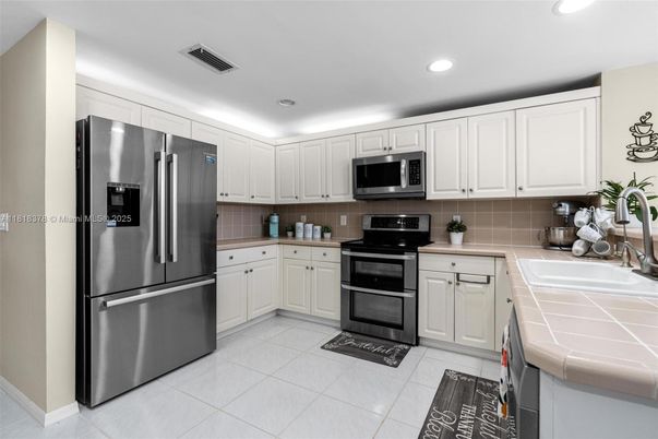 Interior, Kitchen, Recessed Lighting, Stainless Steel Appliances, Tile Countertops