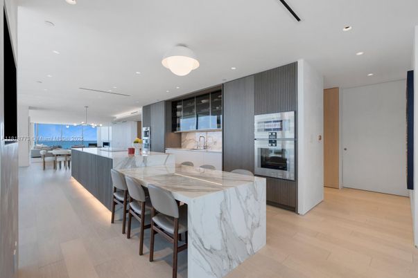 Dining room, Interior, Kitchen, Pendant Lights, Recessed Lighting, Stainless Steel Appliances, Water, Wood Texture Flooring