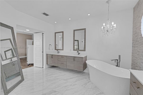 Bathroom, Chandelier, Dual Sink Vanities, Free Standing Baths, Interior, Marble, Marble Walls, Recessed Lighting