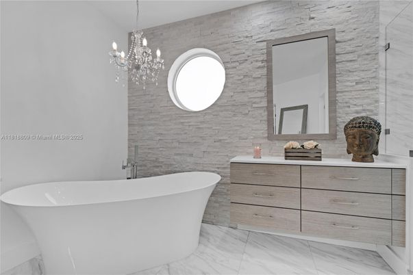 Bathroom, Chandelier, Dual Sink Vanities, Free Standing Baths, Interior, Marble, Marble Walls, Pendant Lights