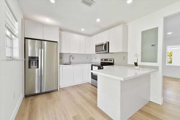 Interior, Kitchen, Recessed Lighting, Stainless Steel Appliances, Wood Texture Flooring