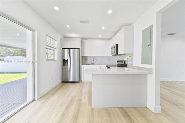 Interior, Kitchen, Recessed Lighting, Stainless Steel Appliances, Wood Texture Flooring