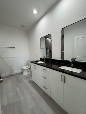 Bathroom, Dual Sink Vanities, Interior, Recessed Lighting, Wood Texture Flooring