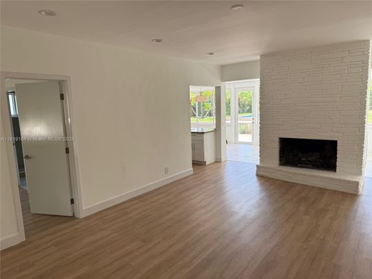 Empty room, Fireplace, Interior, Recessed Lighting, Stone Walls, Wood Texture Flooring