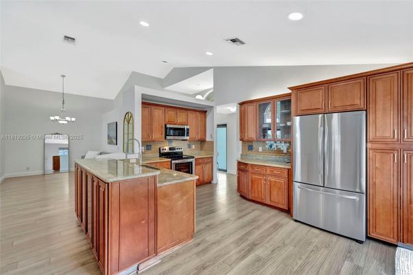 Chandelier, Interior, Kitchen, Pendant Lights, Recessed Lighting, Stainless Steel Appliances, Wood Texture Flooring