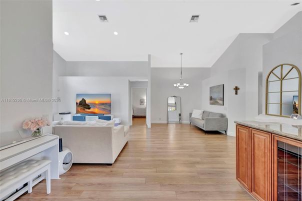 Chandelier, Interior, Living room, Piano, Recessed Lighting, Wood Texture Flooring