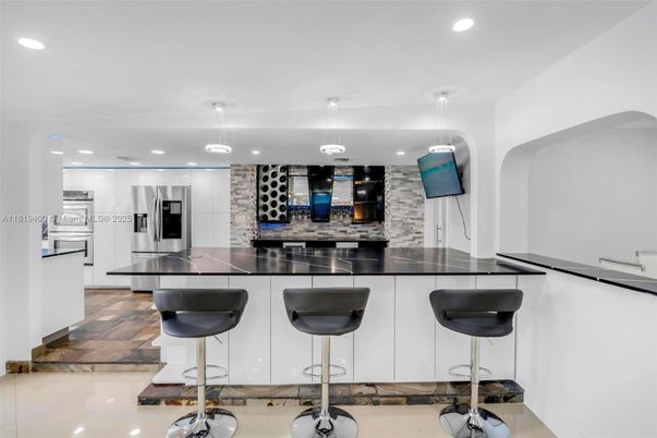 Interior, Kitchen, Pendant Lights, Recessed Lighting, Stainless Steel Appliances, Stone Walls