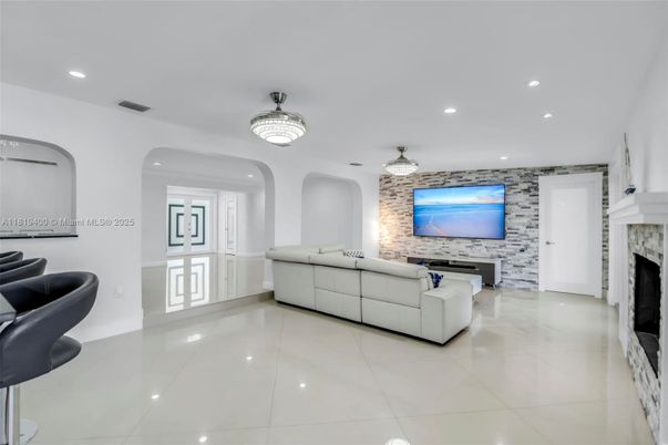 Chandelier, Fireplace, Interior, Living room, Recessed Lighting, Stone Walls