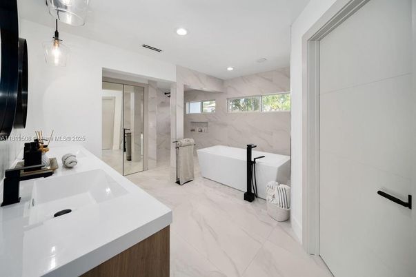 Bathroom, Dual Sink Vanities, Free Standing Baths, Glass Shower, Interior, Marble, Marble Walls, Recessed Lighting
