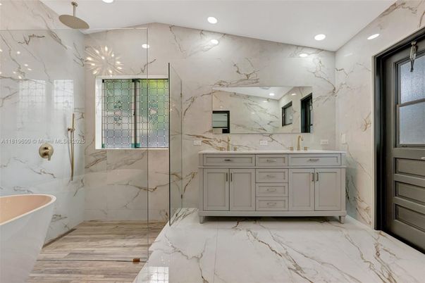 Bathroom, Dual Sink Vanities, Free Standing Baths, Glass Shower, Interior, Marble, Marble Walls, Recessed Lighting