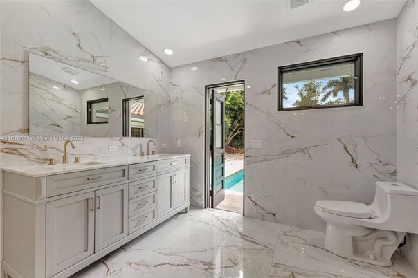 Bathroom, Dual Sink Vanities, Interior, Marble, Marble Walls, Recessed Lighting