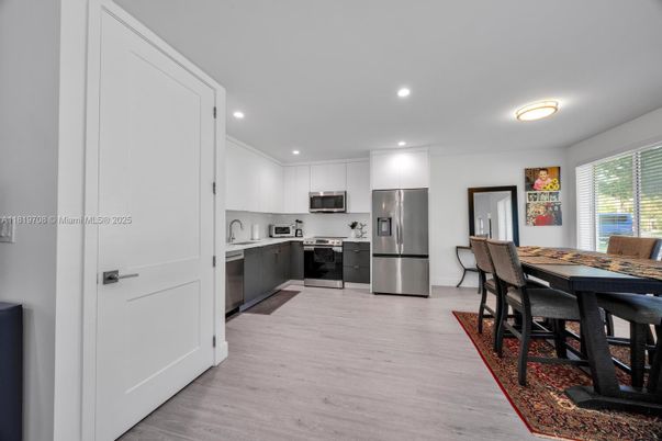 Dining room, Interior, Kitchen, Recessed Lighting, Stainless Steel Appliances, Wood Texture Flooring