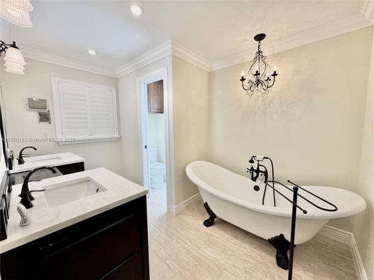 Bathroom, Chandelier, Dual Sink Vanities, Free Standing Baths, Interior, Pendant Lights, Recessed Lighting, Wood Texture Flooring