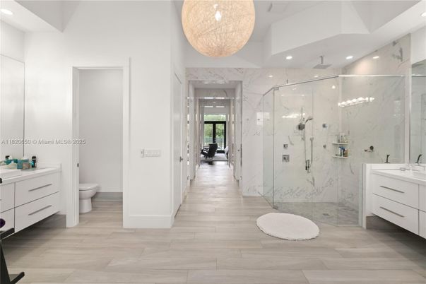 Bathroom, Glass Shower, Interior, Marble Walls, Recessed Lighting, Wood Texture Flooring