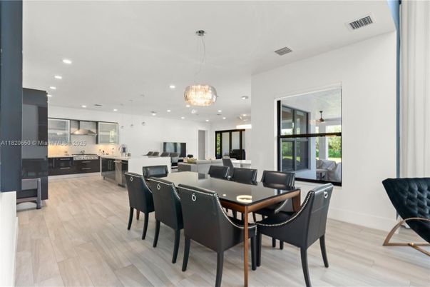 Dining room, Interior, Kitchen, Pendant Lights, Recessed Lighting, Stainless Steel Appliances, Wood Texture Flooring