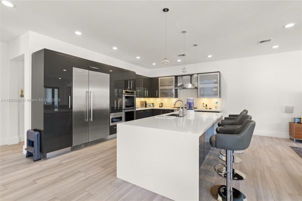 Interior, Kitchen, Pendant Lights, Recessed Lighting, Stainless Steel Appliances, Wood Texture Flooring