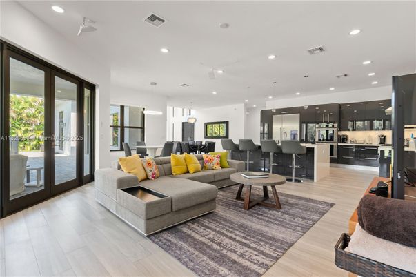 Dining room, Interior, Kitchen, Living room, Pendant Lights, Recessed Lighting, Stainless Steel Appliances, Wood Texture Flooring