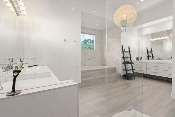 Bathroom, Dual Sink Vanities, Glass Shower, Interior, Marble Walls, Recessed Lighting