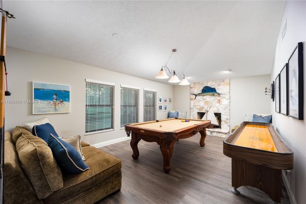 Billiard Table, Fireplace, Game Room, Interior, Pendant Lights, Recessed Lighting, Wood Texture Flooring