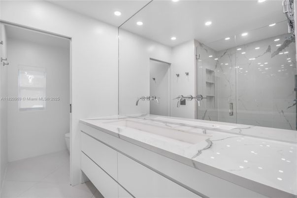 Bathroom, Dual Sink Vanities, Glass Shower, Interior, Marble Walls, Recessed Lighting