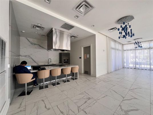 Interior, Kitchen, Marble, Marble Walls, Pendant Lights, Recessed Lighting, Stainless Steel Appliances
