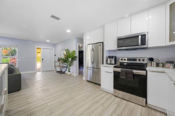Interior, Kitchen, Recessed Lighting, Stainless Steel Appliances, Wood Texture Flooring