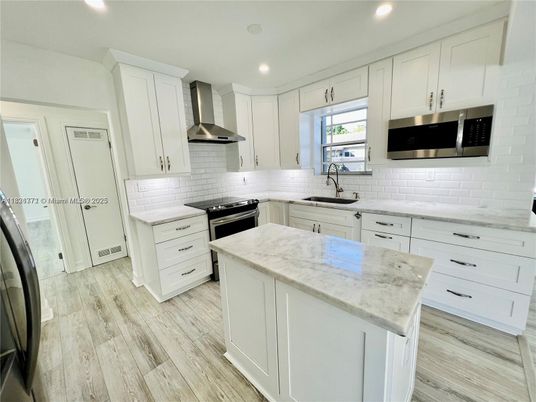 Interior, Kitchen, Recessed Lighting, Stainless Steel Appliances, Wood Texture Flooring
