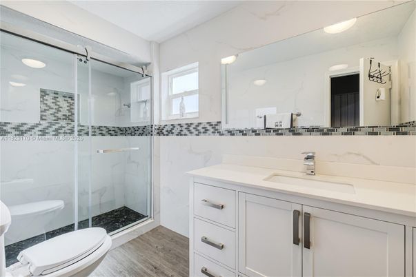 Bathroom, Glass Shower, Interior, Marble Walls, Wood Texture Flooring
