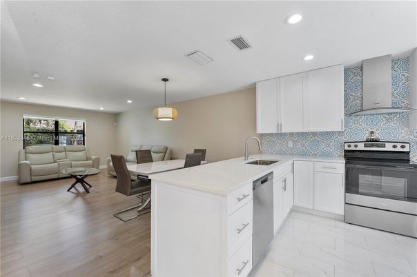 Dining room, Interior, Kitchen, Living room, Marble, Pendant Lights, Recessed Lighting, Stainless Steel Appliances, Wood Texture Flooring