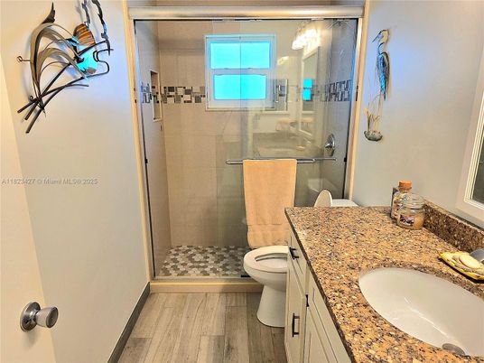 Bathroom, Dual Sink Vanities, Glass Shower, Interior, Wood Texture Flooring