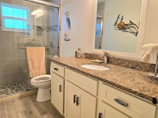 Bathroom, Dual Sink Vanities, Glass Shower, Interior, Wood Texture Flooring