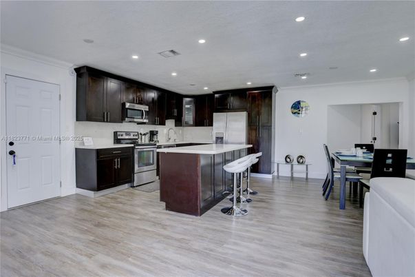 Dining room, Interior, Kitchen, Recessed Lighting, Stainless Steel Appliances, Wood Texture Flooring