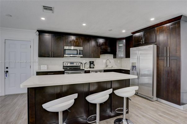 Interior, Kitchen, Recessed Lighting, Stainless Steel Appliances, Wood Texture Flooring