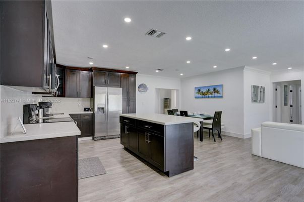 Dining room, Interior, Kitchen, Recessed Lighting, Stainless Steel Appliances, Wood Texture Flooring