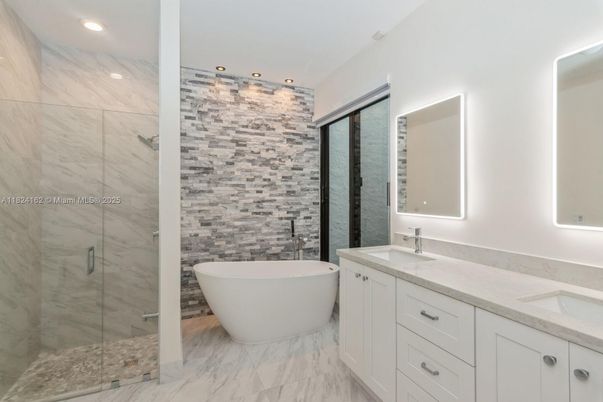Bathroom, Dual Sink Vanities, Free Standing Baths, Glass Shower, Interior, Marble, Marble Walls, Recessed Lighting