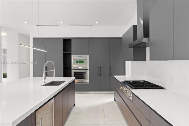 Interior, Kitchen, Marble Walls, Recessed Lighting, Stainless Steel Appliances