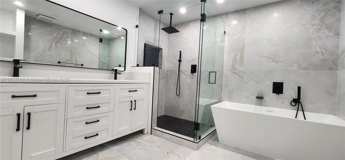 Bathroom, Free Standing Baths, Glass Shower, Interior, Marble Walls, Recessed Lighting