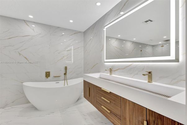 Bathroom, Dual Sink Vanities, Free Standing Baths, Interior, Marble, Marble Walls, Recessed Lighting