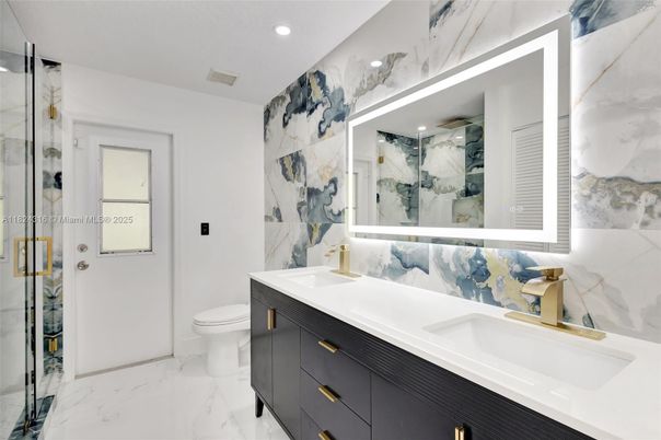 Bathroom, Dual Sink Vanities, Glass Shower, Interior, Marble, Marble Walls, Recessed Lighting