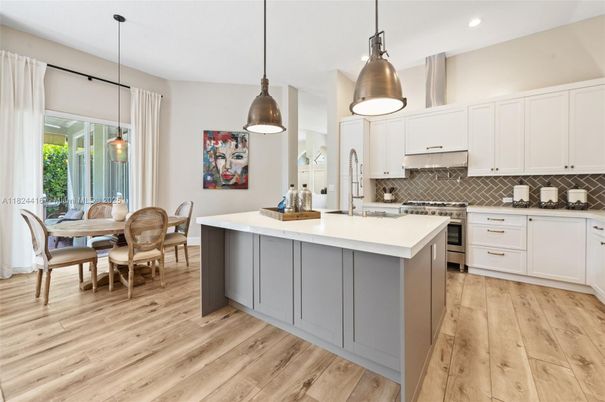 Dining room, Interior, Kitchen, Pendant Lights, Recessed Lighting, Stainless Steel Appliances, Wood Texture Flooring