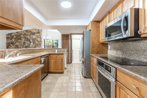 Interior, Kitchen, Pendant Lights, Recessed Lighting, Stainless Steel Appliances, Stone Walls