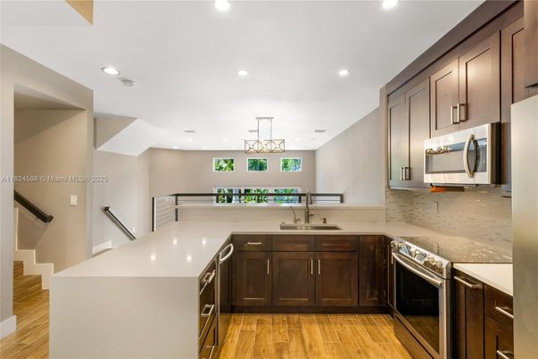 Interior, Kitchen, Pendant Lights, Recessed Lighting, Stainless Steel Appliances, Wood Texture Flooring