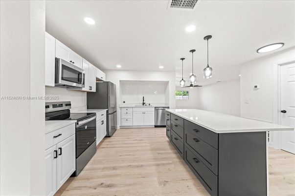 Interior, Kitchen, Pendant Lights, Recessed Lighting, Stainless Steel Appliances, Wood Texture Flooring